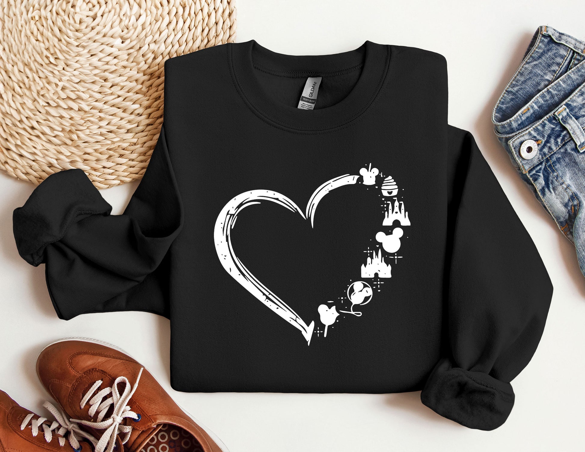 a black sweatshirt with a white heart on it