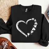 a black sweatshirt with a white heart on it