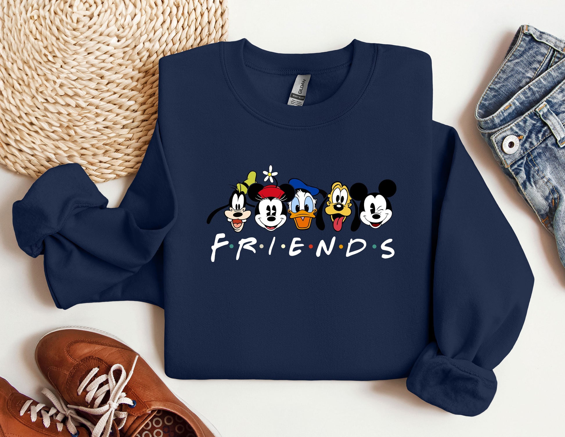 a blue sweatshirt with mickey mouse and friends on it