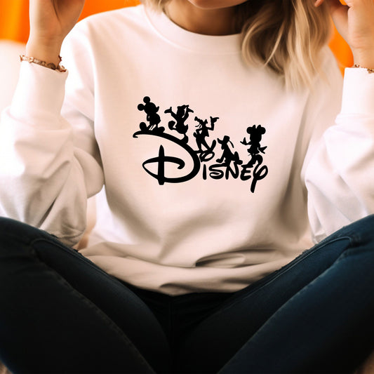 a woman sitting on the floor wearing a disney shirt