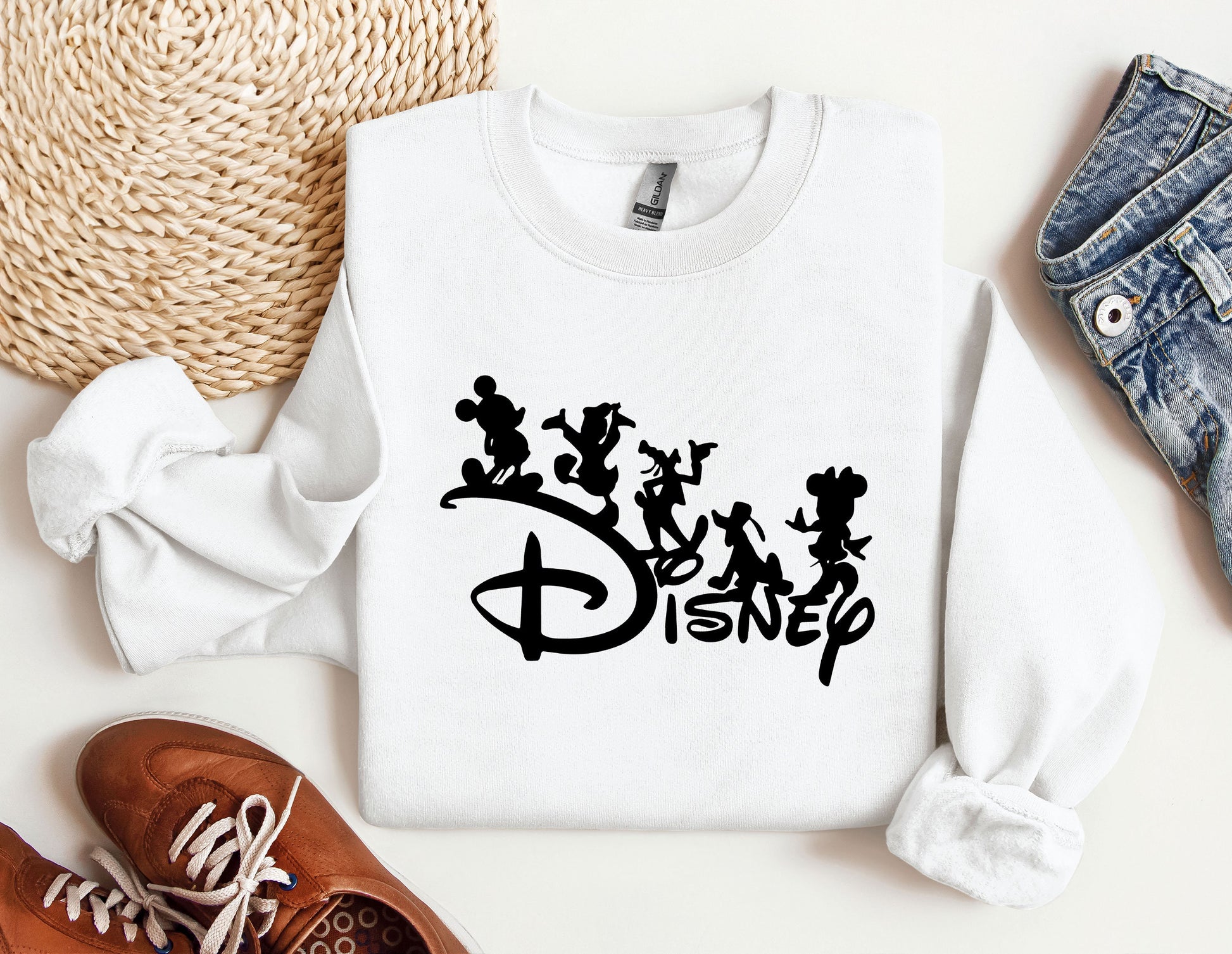 a white shirt with the word disney printed on it