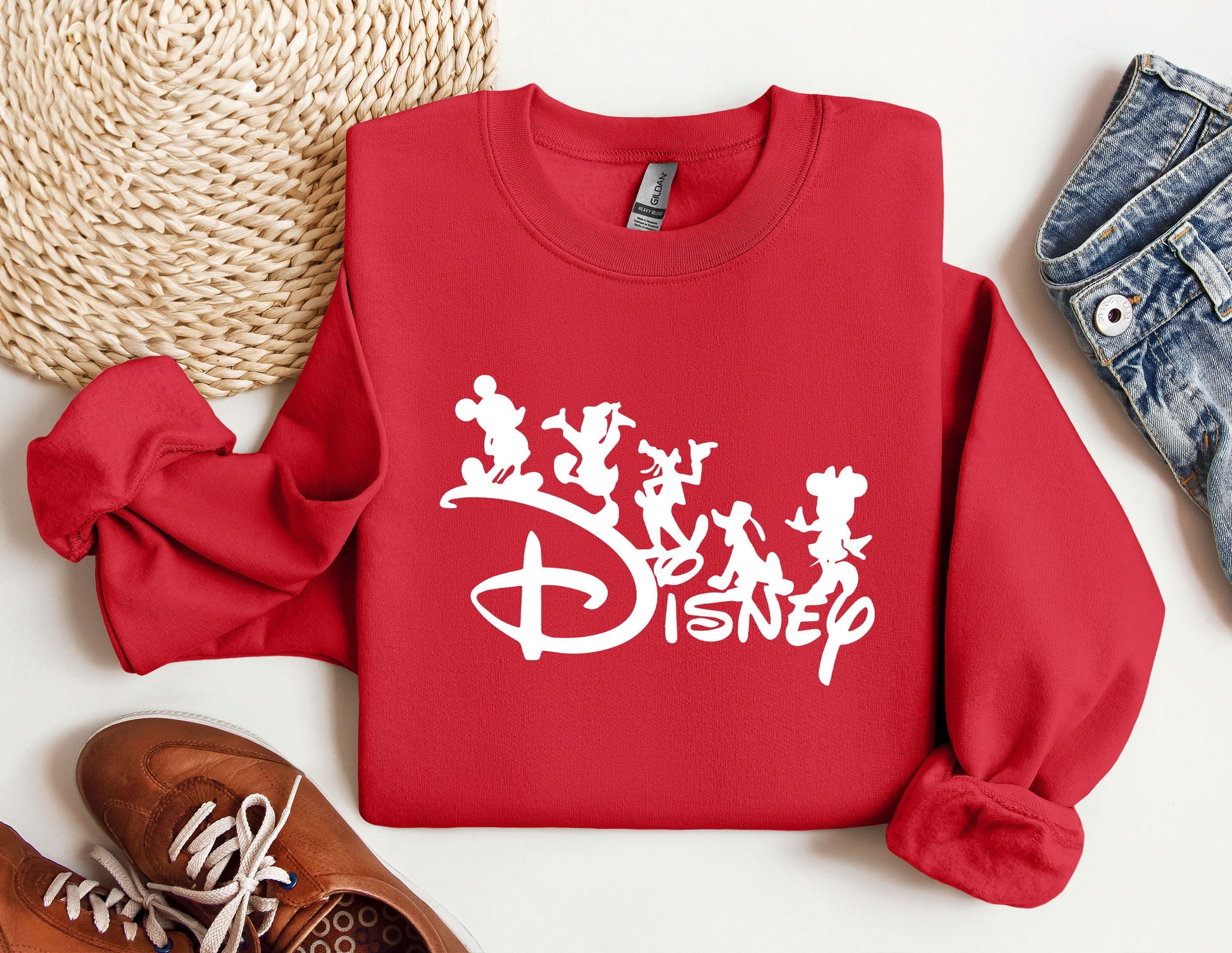 a red sweatshirt with disney characters on it