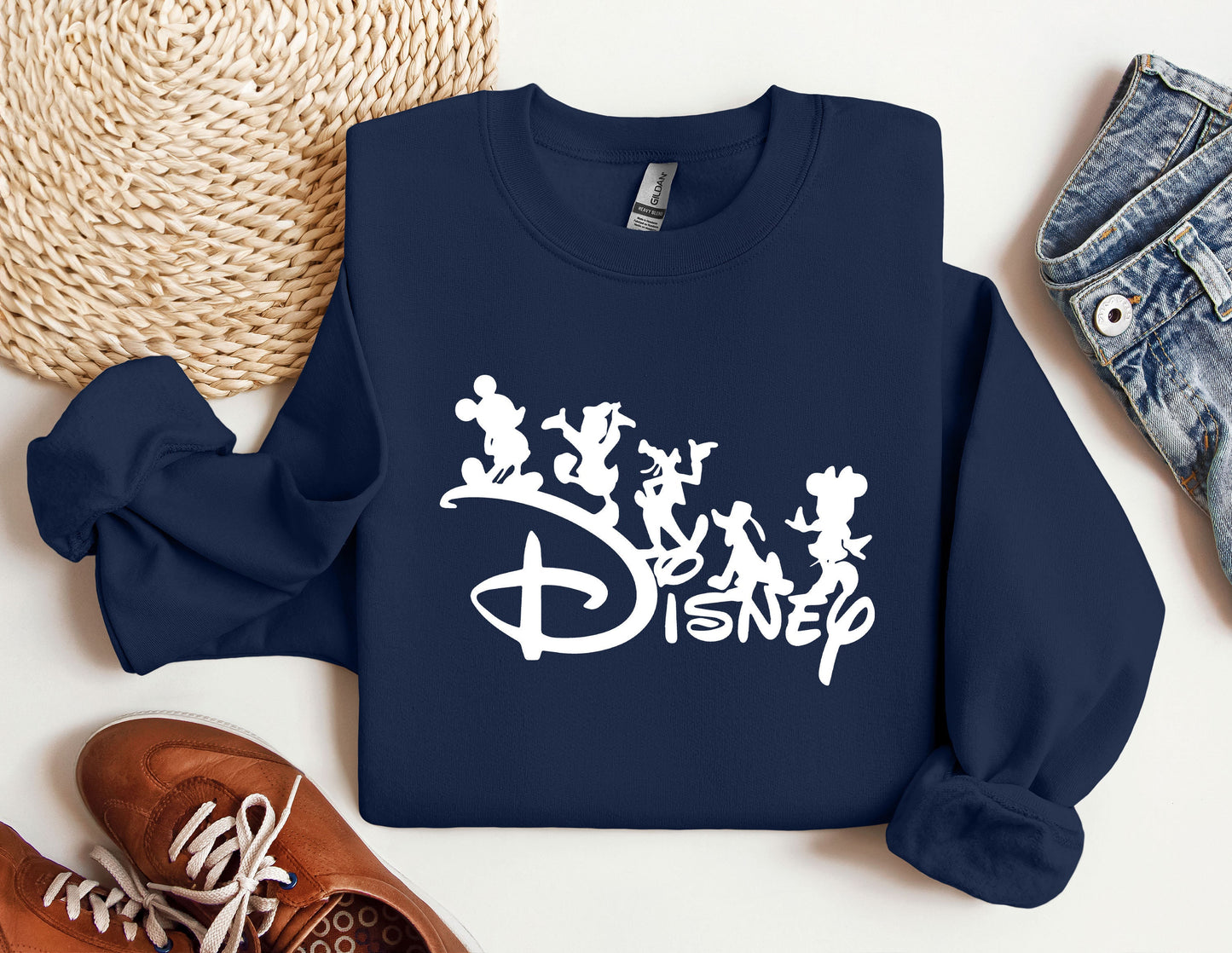 a blue sweatshirt with disney characters on it