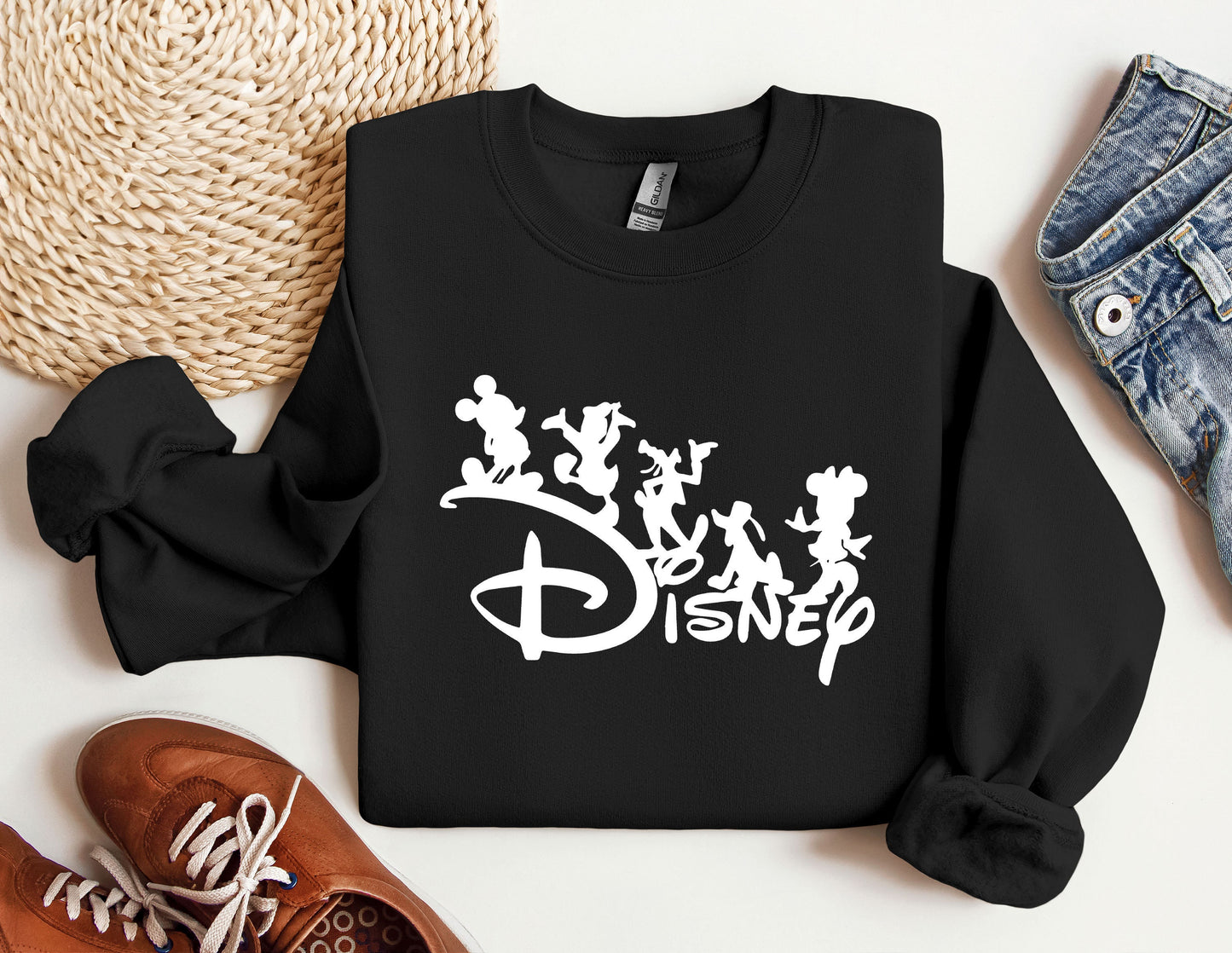 a black sweatshirt with disney characters on it