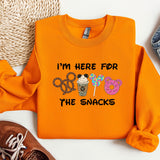 a pair of shoes and an orange shirt with the words i'm here for