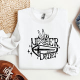 a white sweater with a black lettering on it