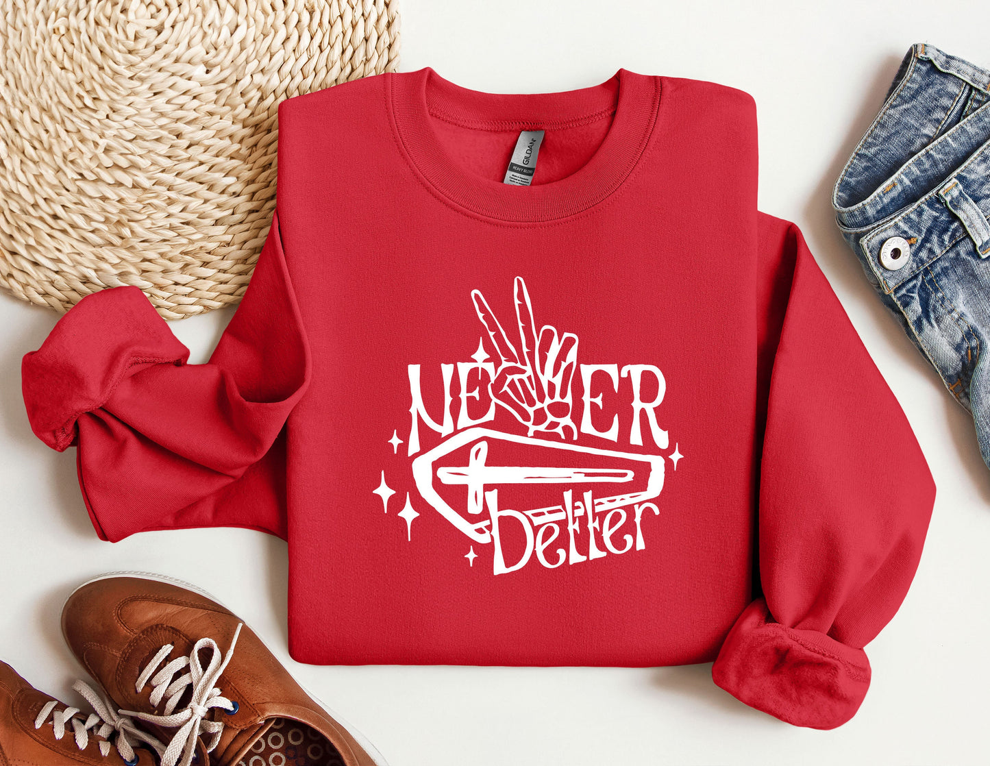 a red sweater with the words never better on it