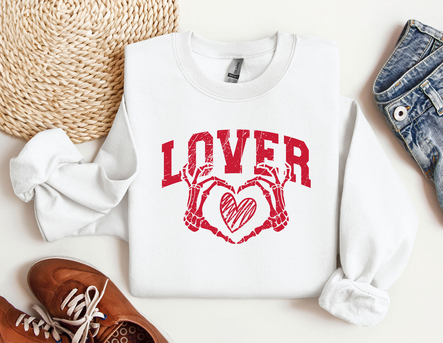 a pair of shoes and a sweater with the word lover on it