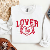 a pair of shoes and a sweater with the word lover on it