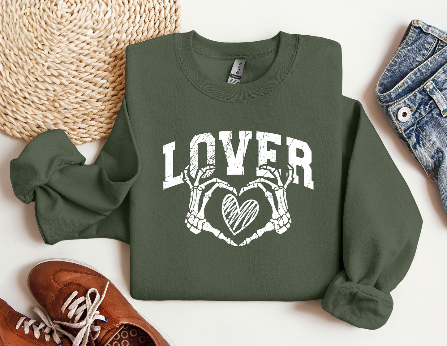 a green sweatshirt with the words lover and two crossed hands