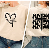 a woman wearing a sweatshirt with a cross and heart on it