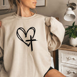 a woman wearing a sweatshirt with a heart drawn on it