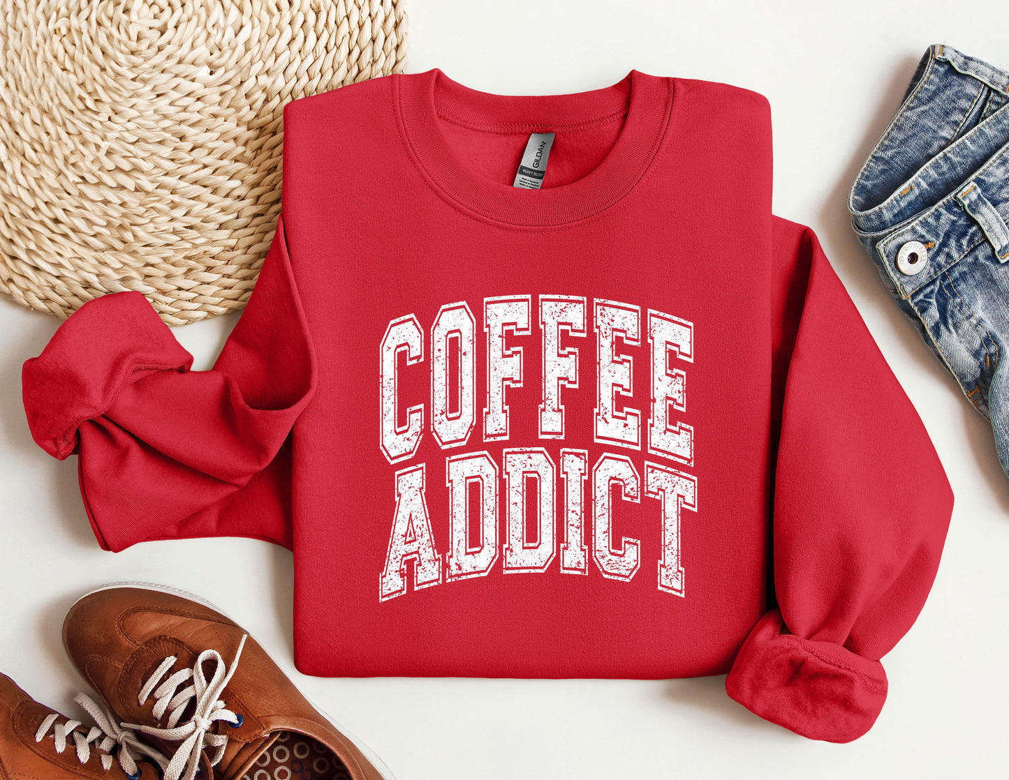 a red sweatshirt with the words coffee addict on it