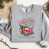 a gray sweatshirt with christmas trees and mickey mouse's tree farm on it