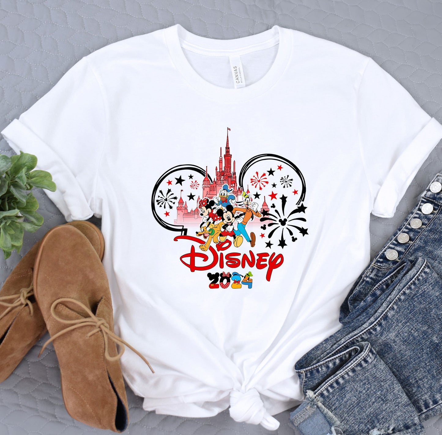 a white shirt with a mickey mouse design on it