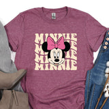 a minnie mouse shirt with a pink bow on it
