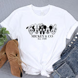 a mickey and mickey mouse t - shirt next to a pair of jeans