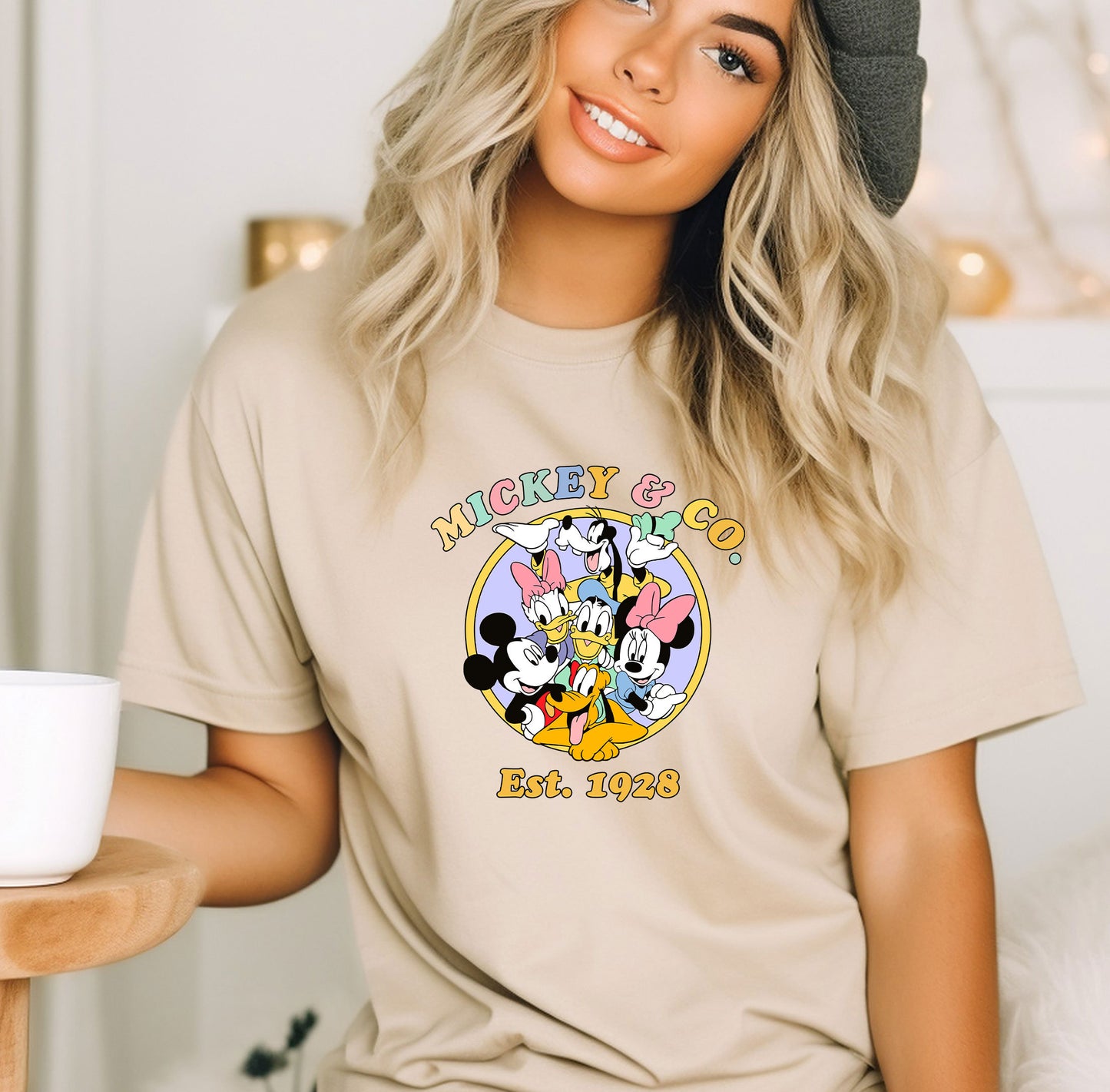 a woman wearing a mickey mouse t - shirt