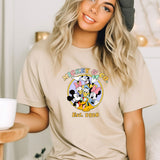a woman wearing a mickey mouse t - shirt