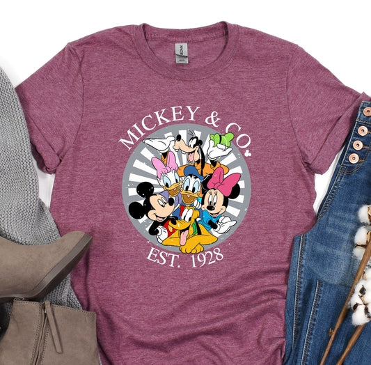 a mickey and mickey mouse shirt next to a pair of jeans