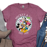 a mickey and mickey mouse shirt next to a pair of jeans