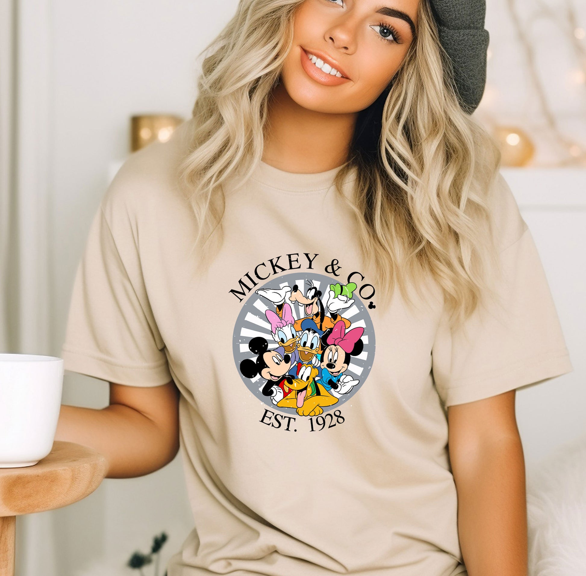 a woman wearing a mickey and mickey mouse t - shirt