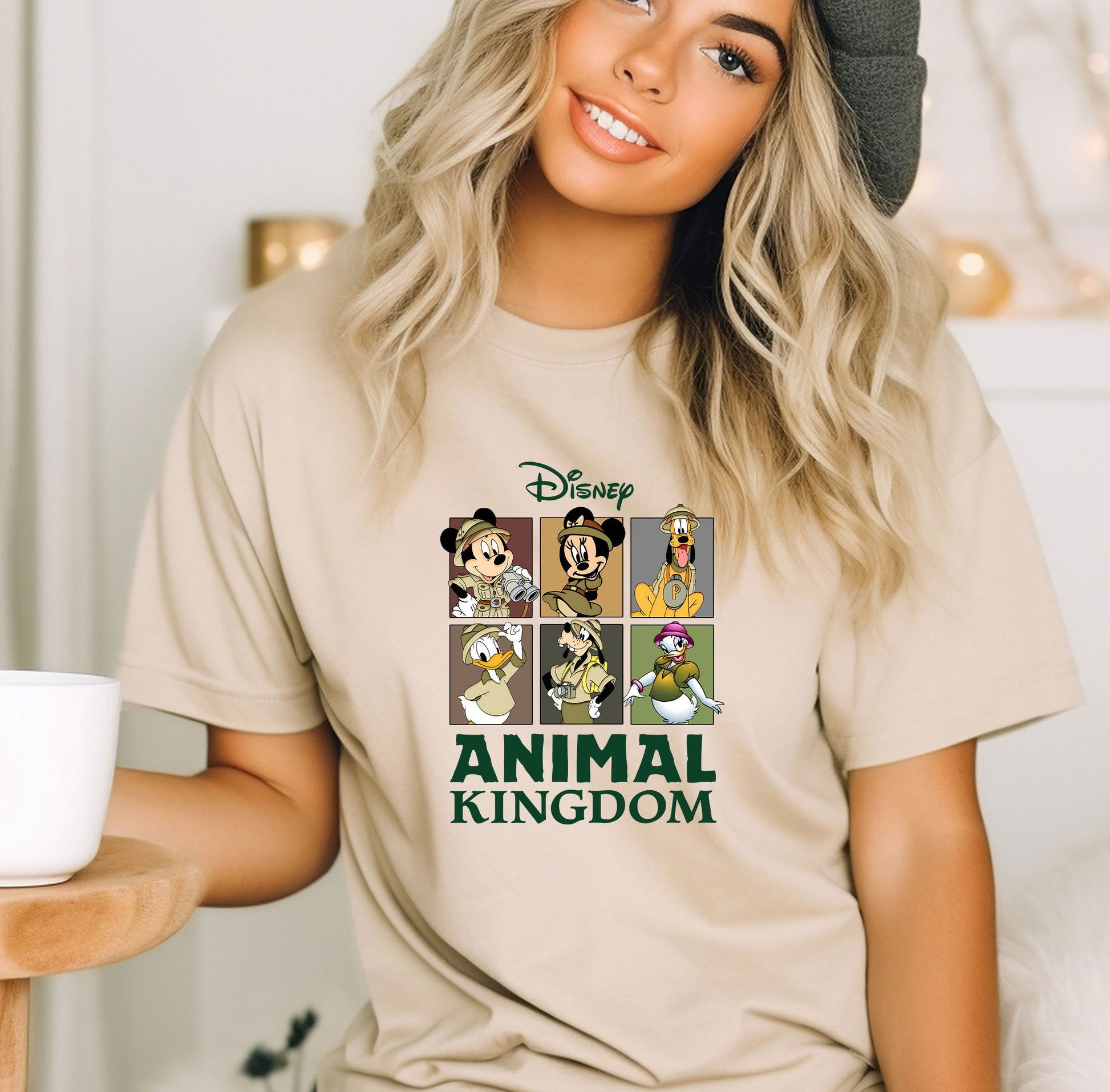 a woman wearing a t - shirt that says animal kingdom