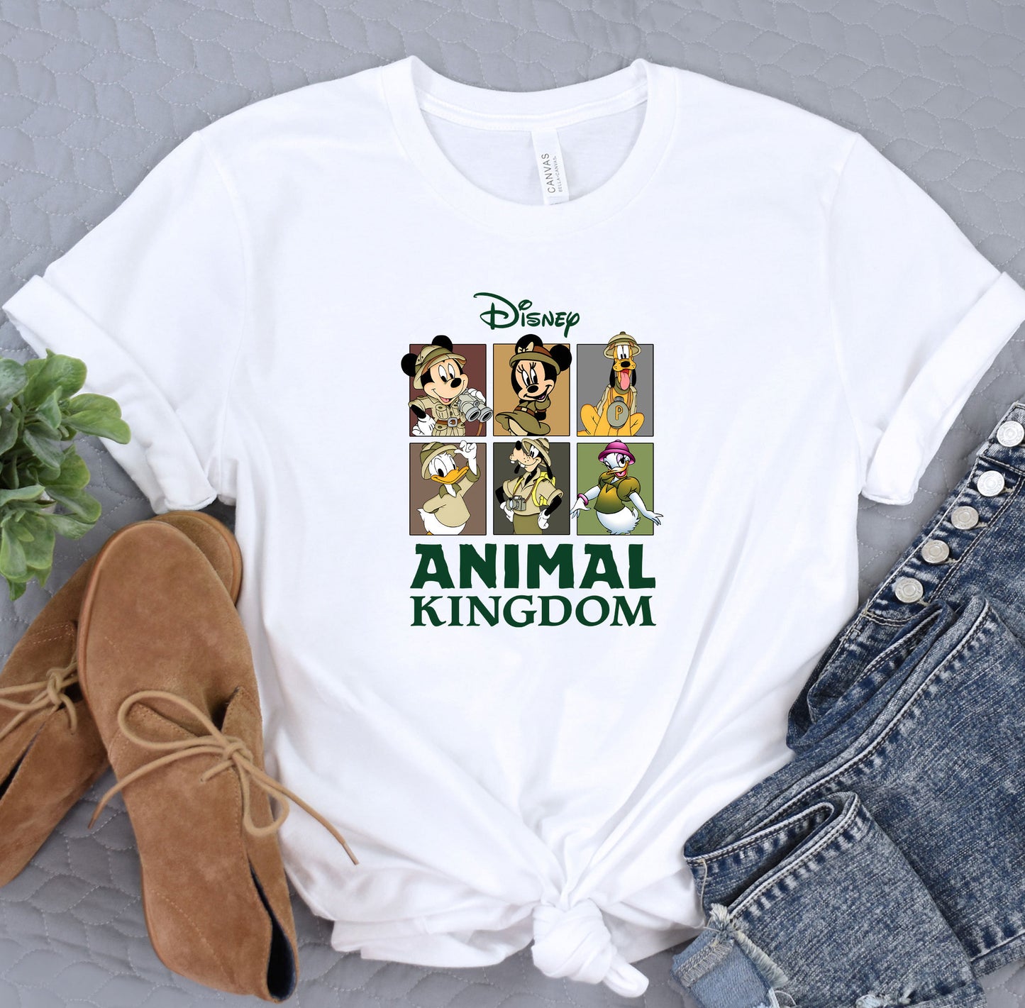 a t - shirt with the characters of disney and the animal kingdom on it