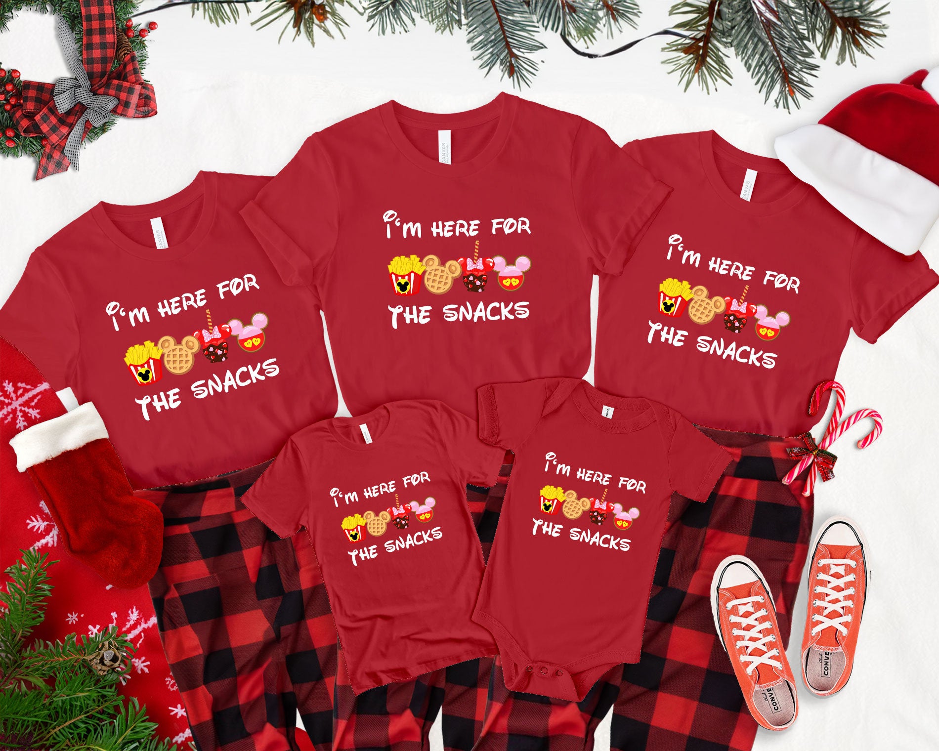 a family of four wearing matching christmas pajamas