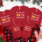 a family of four wearing matching christmas pajamas