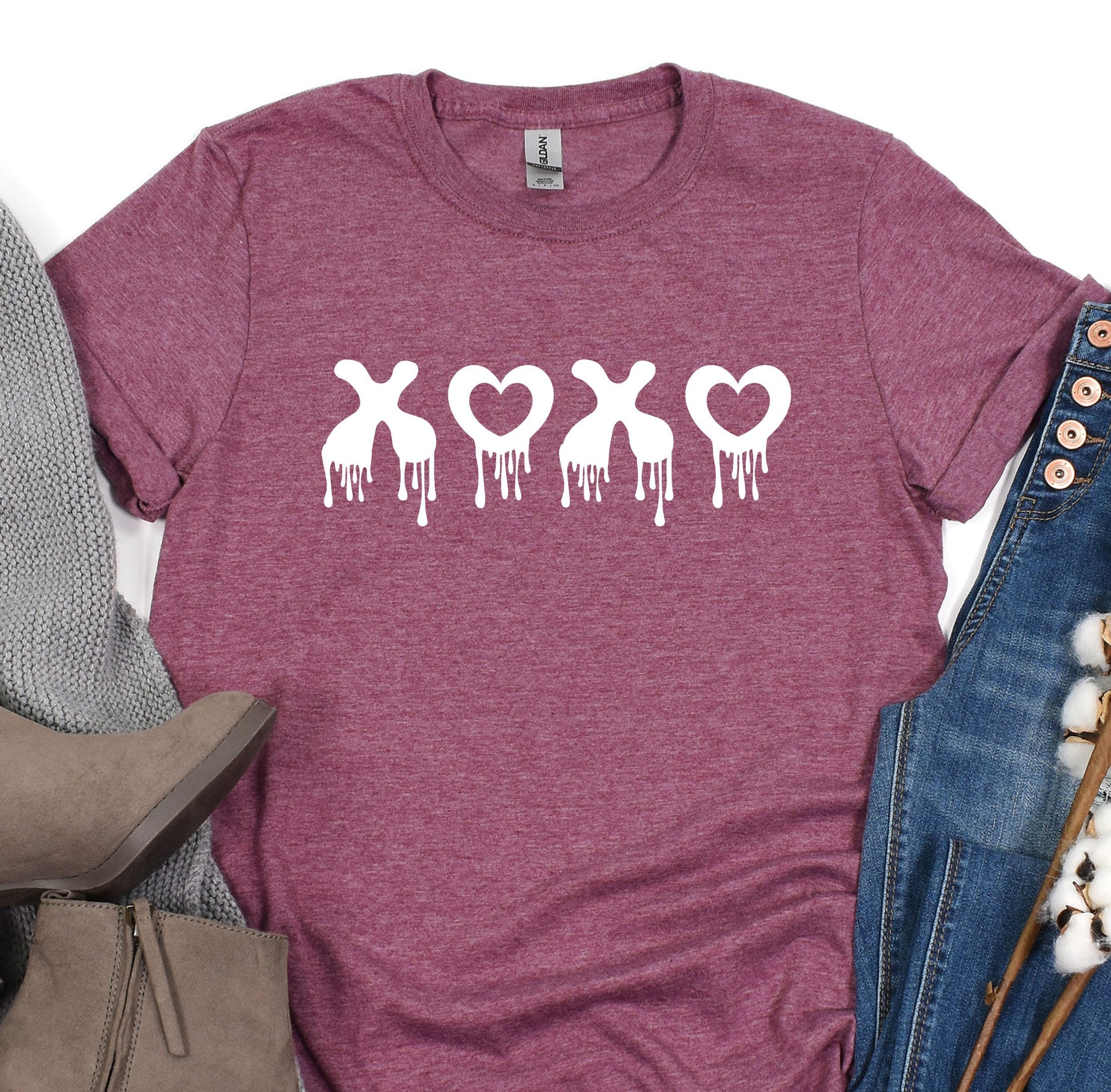 a t - shirt with a heart and crossbones on it