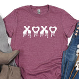 a t - shirt with a heart and crossbones on it