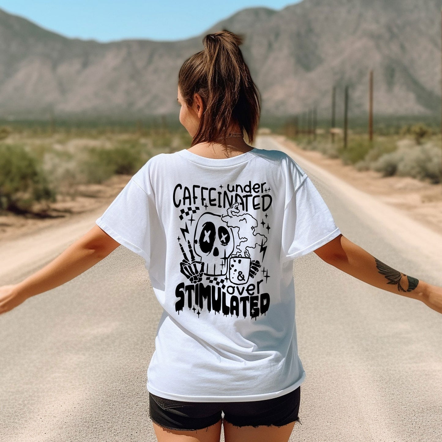 a woman walking down a road with her arms outstretched