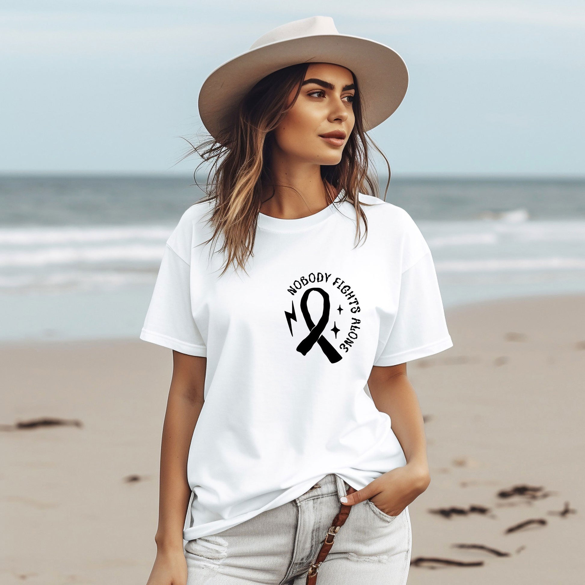 a woman wearing a white t - shirt with a black ribbon on it