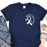 a t - shirt with a ribbon and a pair of jeans