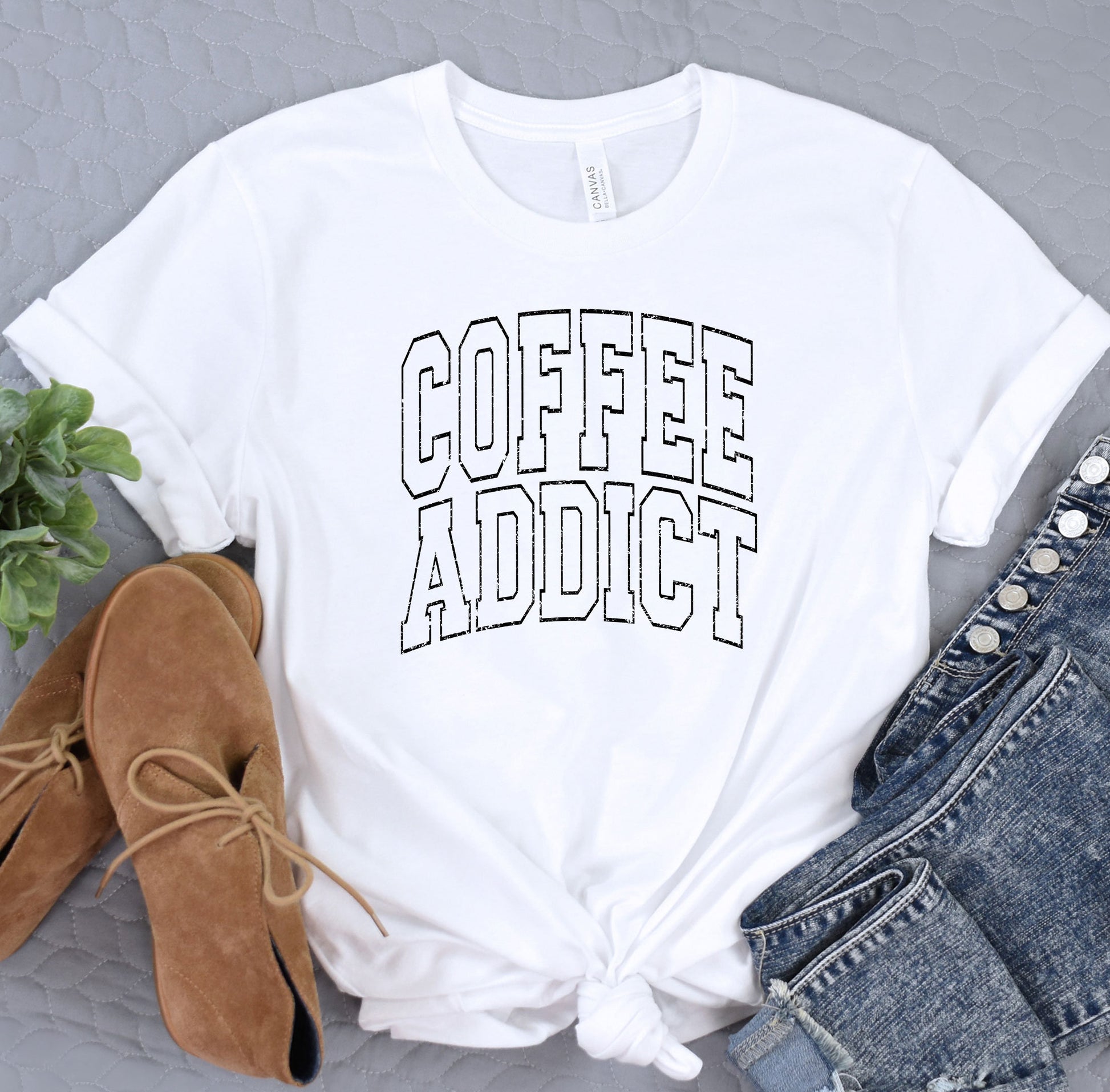 a white t - shirt with the words coffee addict on it