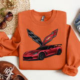 an orange sweatshirt with a red sports car on it