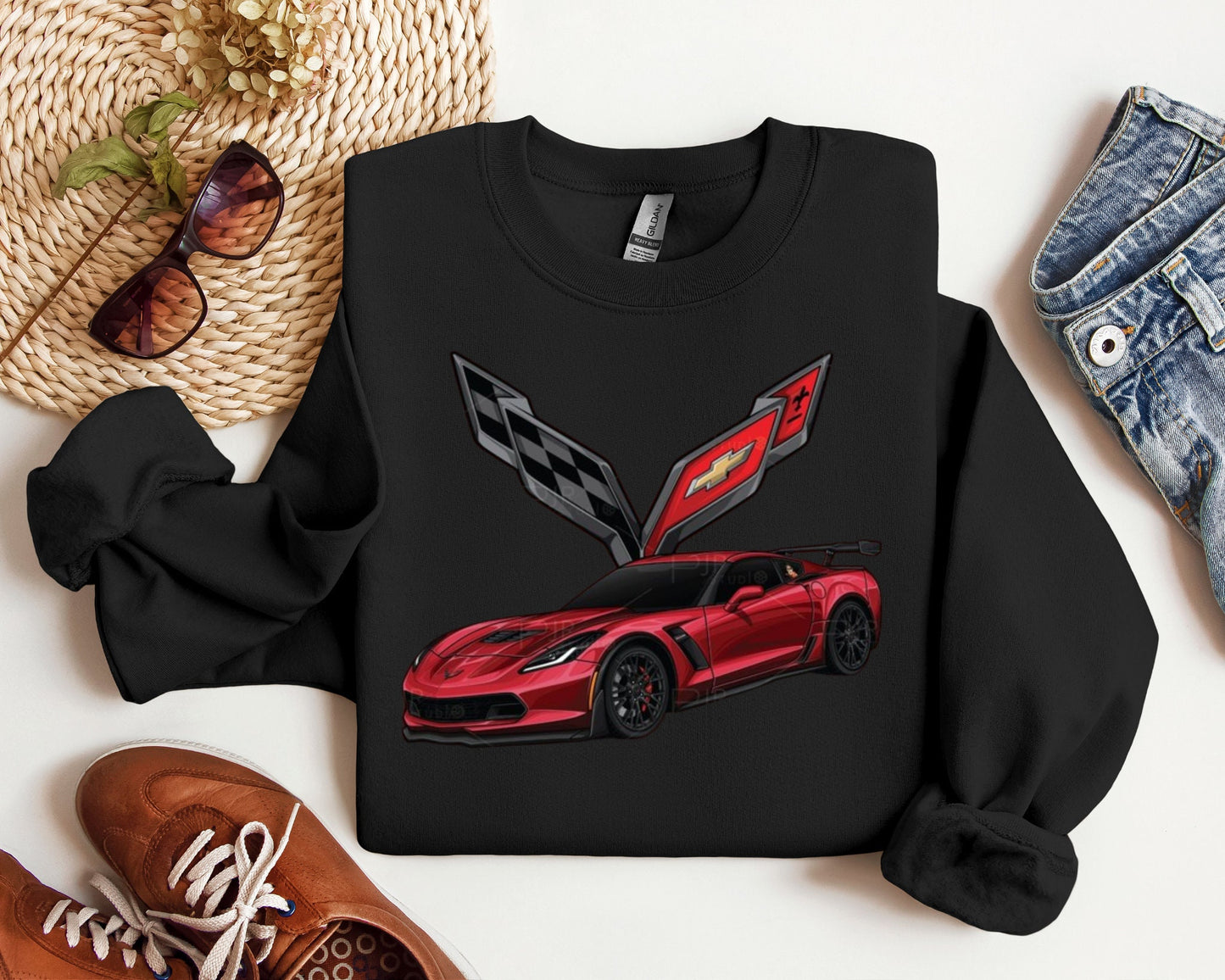 a black sweatshirt with a red car on it