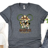 a mickey mouse t - shirt sitting on top of a table