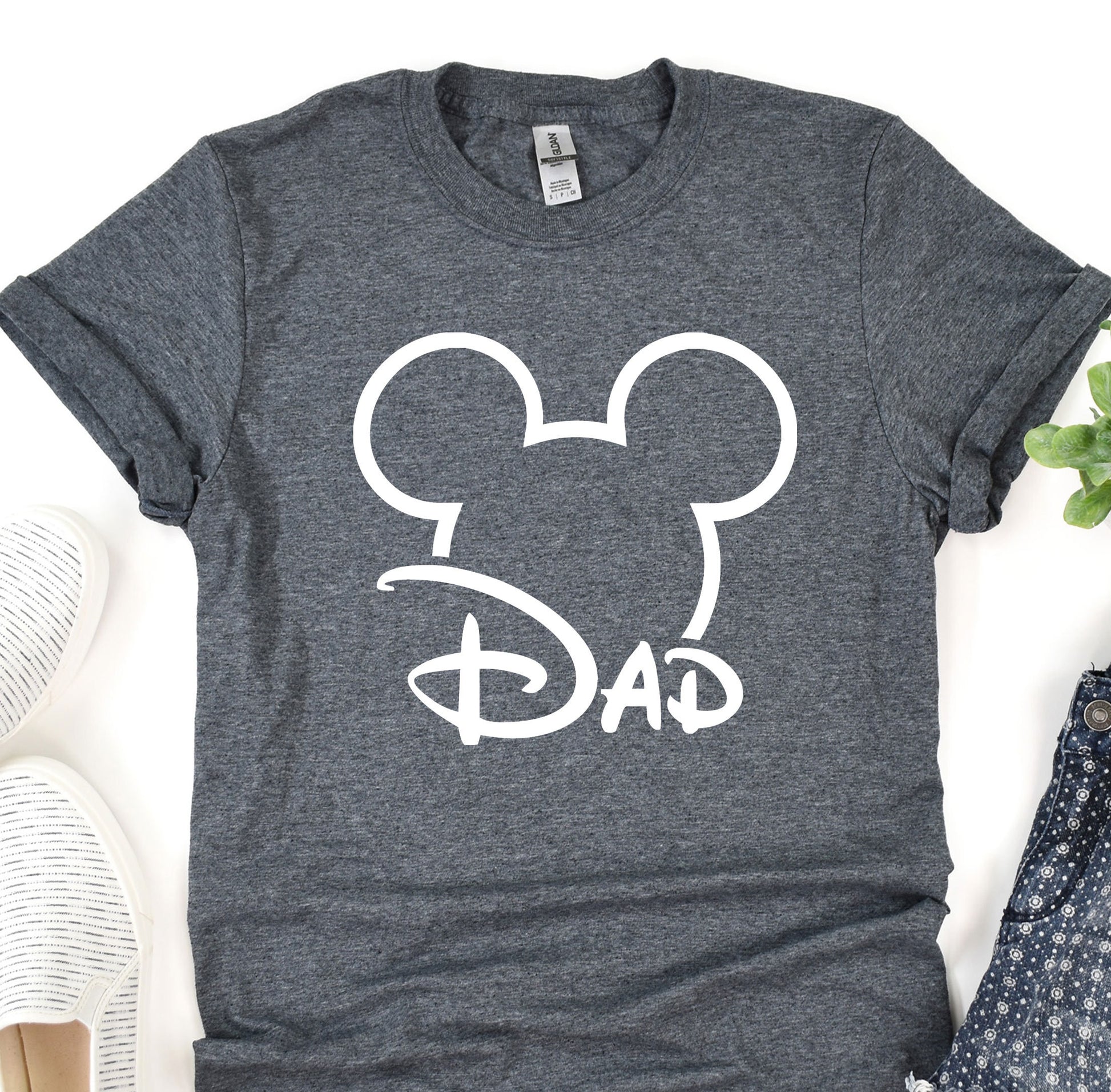 a mickey mouse shirt with the word gap on it