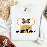 a white shirt with a mickey mouse ears and giraffes on it