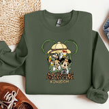 a green sweatshirt with mickey mouse and friends on it