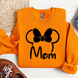 an orange shirt with a black bow on it