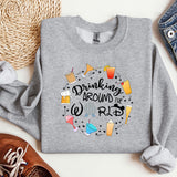a sweatshirt that says drinking around the world