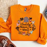an orange shirt with a mickey mouse design on it