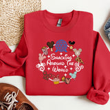 a red shirt with a message on it next to a pair of shoes
