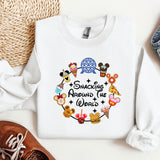a white shirt with mickey mouses around the world on it