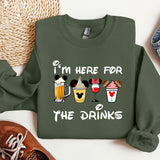 a green sweatshirt with a mickey mouse design on it