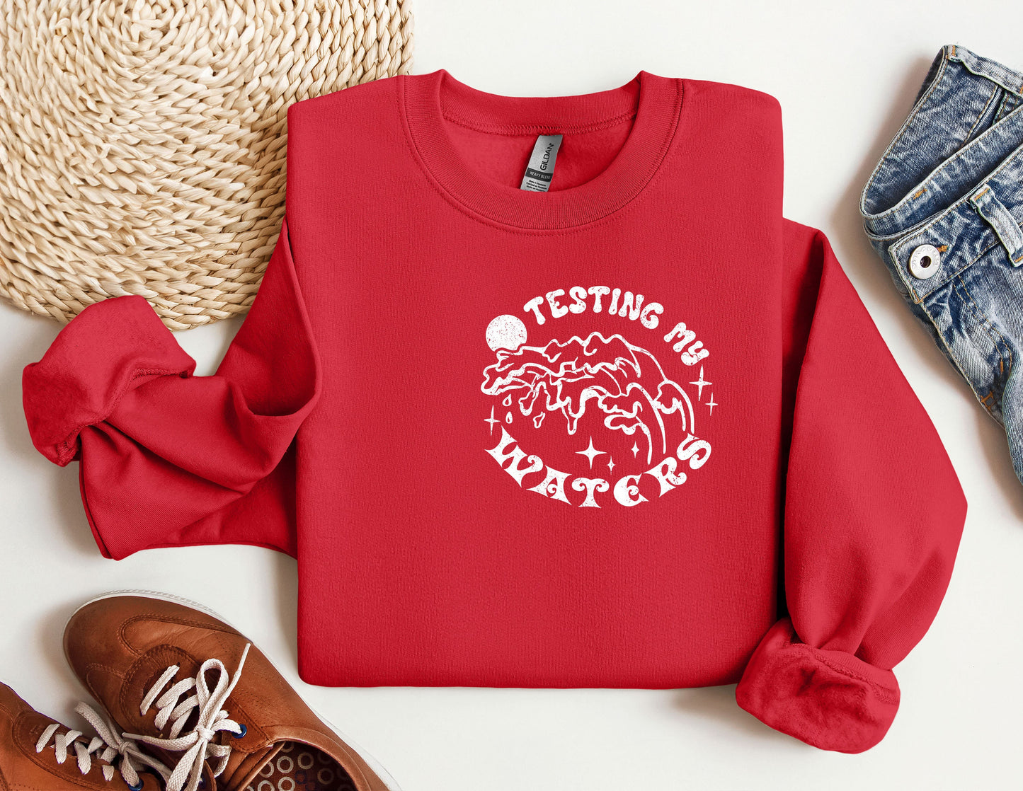 a red sweatshirt with a white print on it