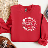 a red sweatshirt with a white print on it
